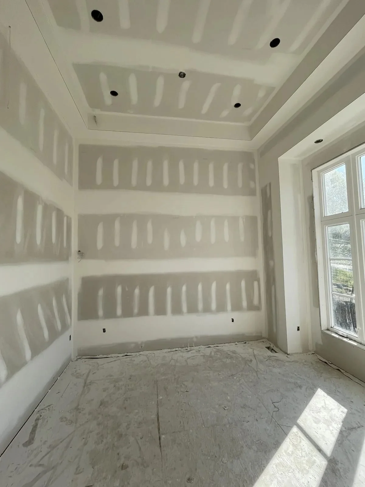 Custom home taping first coat